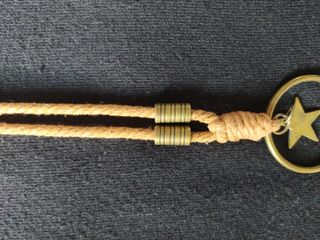 Collar largo con aro, estrella y pluma