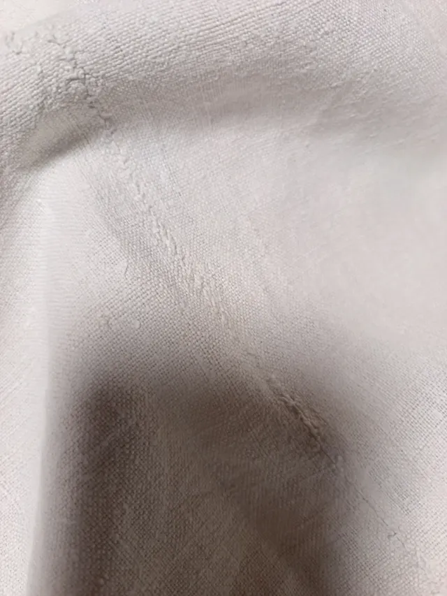 Pezzo di lino unito a metà