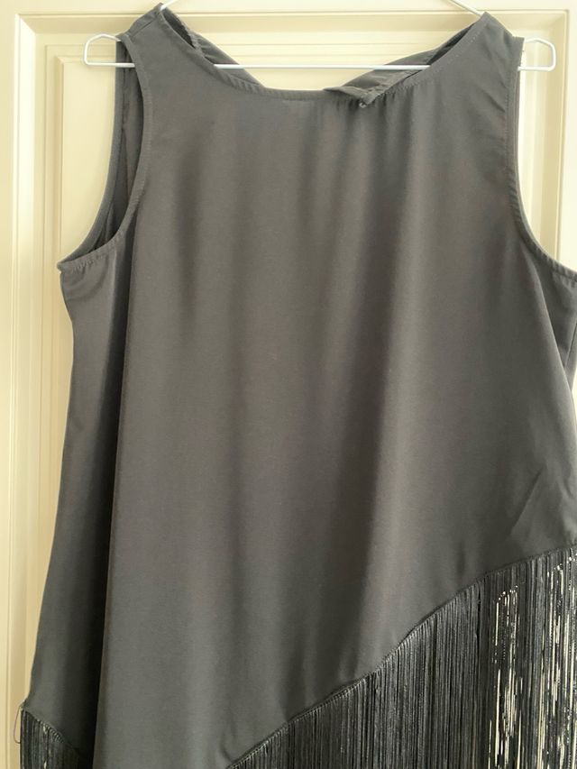 Blusón negro con flecos