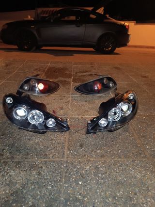 Faros Peugeot 206 ojos de ángel fondo negro

