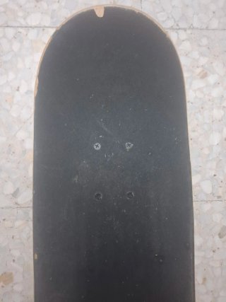 Monopatín Oxelo con diseño de mono