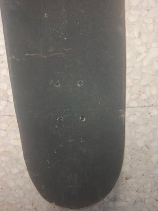 Monopatín Oxelo con diseño de mono