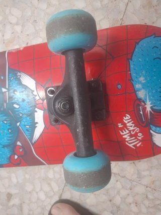 Monopatín Oxelo con diseño de mono