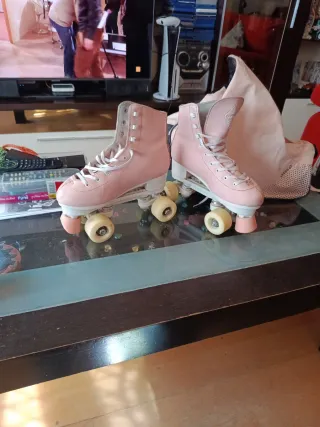 Patines de 4 ruedas color rosa con bolsa

