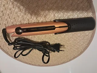 Plancha ghd negra y dorada