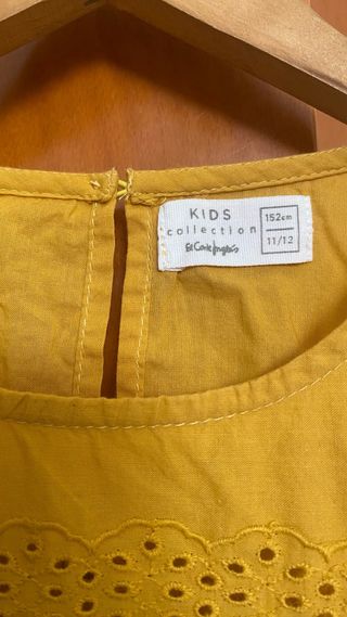 Camisa amarilla sin mangas con bordados