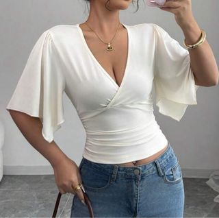 Top blanco escote cruzado manga acampanada