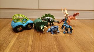 Lotto di giocattoli: auto, dinosauri e rane