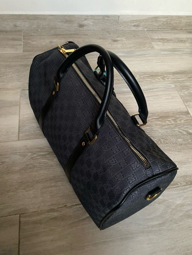 Bolsa de viaje Jordan negra y dorada