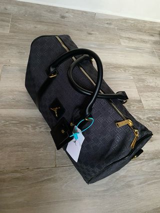 Bolsa de viaje Jordan negra y dorada