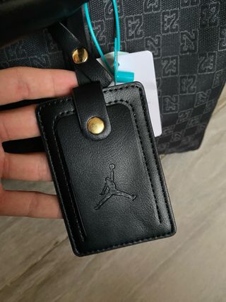 Bolsa de viaje Jordan negra y dorada