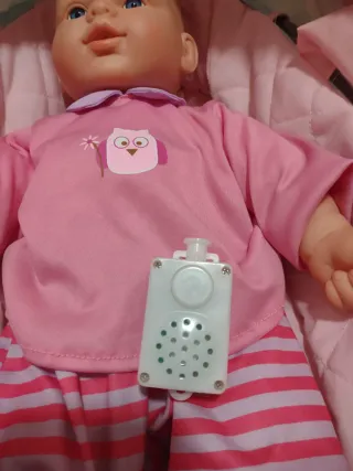 Silleta de juguete con muñeco y sonido