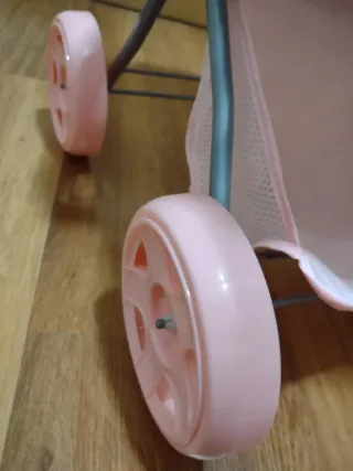 Silleta de juguete con muñeco y sonido