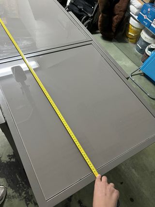 Mesa extensible de metal y cristal