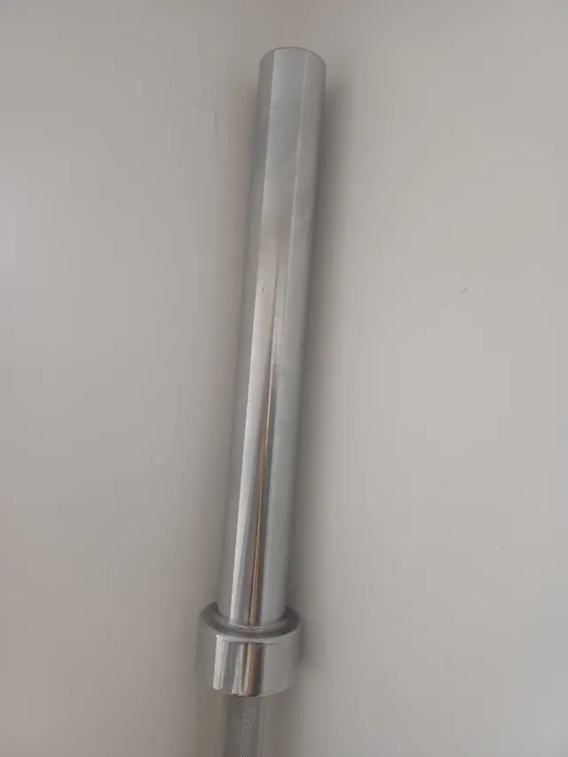 Barra Olímpica 20 kg y las 2 losetas de caucho