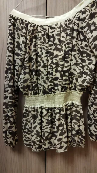 Blusa corte péplum . M/L