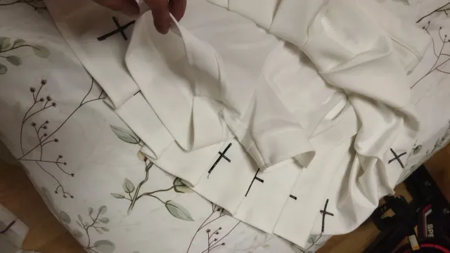 Falda tableada juvenil con short y detalle cruz