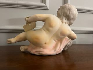 Bimbo neonato in ceramica con cesto fiori