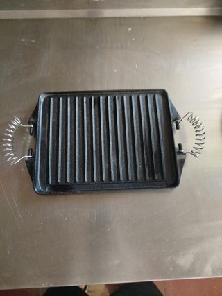Plancha de hierro fundido con asas comida