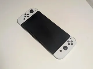 Nintendo Switch OLED + controller wireless + giochi