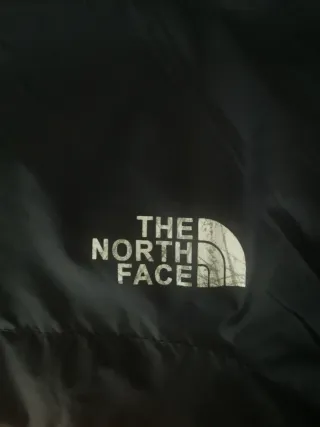 Cortavientos The North Face azul y naranja