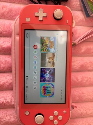 Nintendo Switch Lite Coral + Animal Crossing