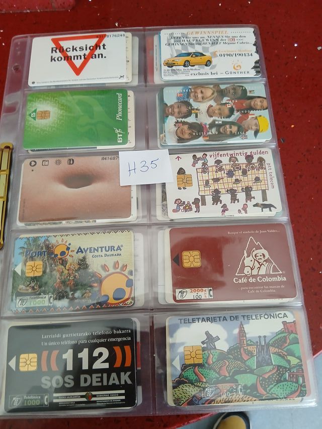 60 schede telefoniche World con fogli H35