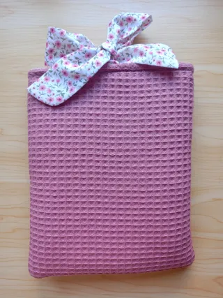 Funda de tela con lazos