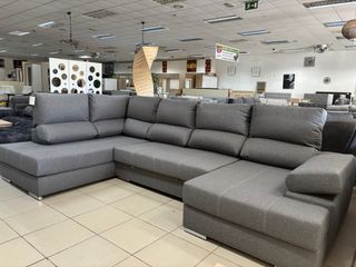 Sofá rinconera gris con doble chaise longue cama