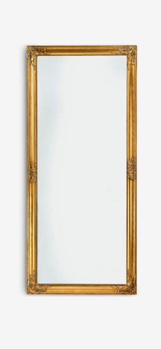 Espejo de pared dorado con marco ornamentado