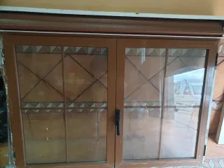 Ventana con persiana y cristales climalit