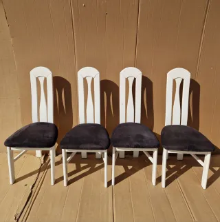 Juego de 4 sillas blancas y negras