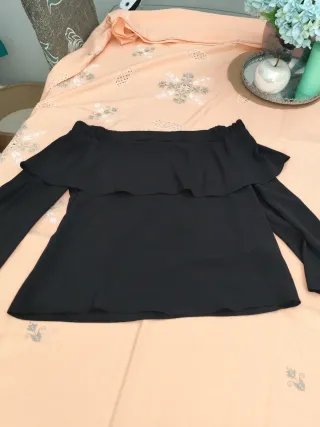 Blusa negra escote barco manga larga