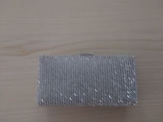Bolso de fiesta plateado con pedrería