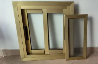 Ventana corredera aluminio dorada