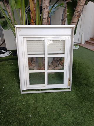 Ventana aluminio con persiana y  premarco y rejas