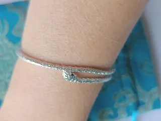 Pulsera de plata serpiente con ojos verdes