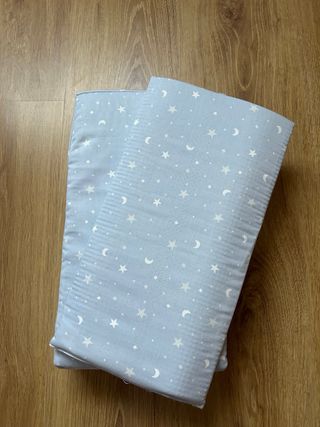 Almohadilla de bolillos azul con estrellas