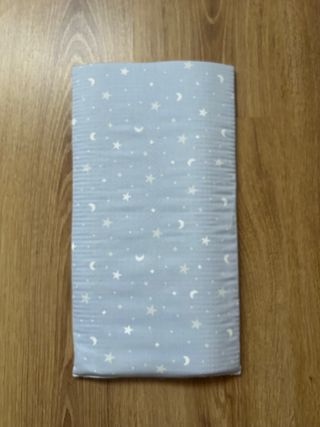 Almohadilla de bolillos azul con estrellas