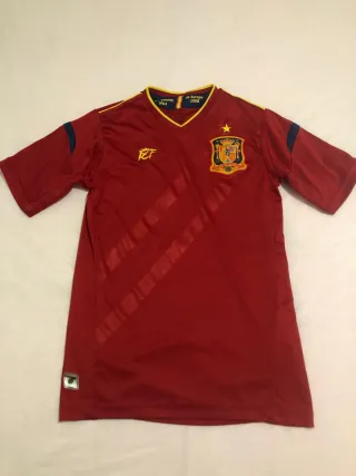Camiseta España Niño Talla S .
De imitacion.