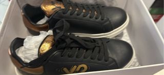 Scarpe sneakers nere e oro