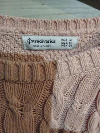 Maglione rosa trecce