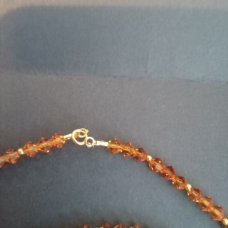 Conjunto cristal de Swarovski ambar y oro 18k.
