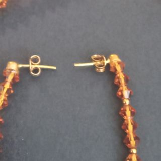 Conjunto cristal de Swarovski ambar y oro 18k.