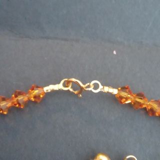 Conjunto cristal de Swarovski ambar y oro 18k.