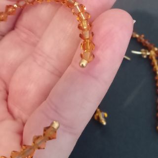 Conjunto cristal de Swarovski ambar y oro 18k.