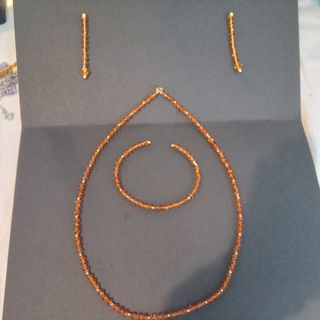 Conjunto cristal de Swarovski ambar y oro 18k.