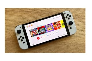 Nintendo Switch OLED + 1 TB bianco + controller PRO