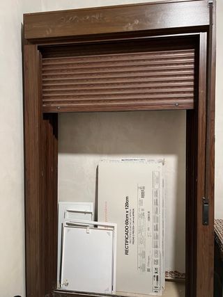 Puerta balconera con persiana