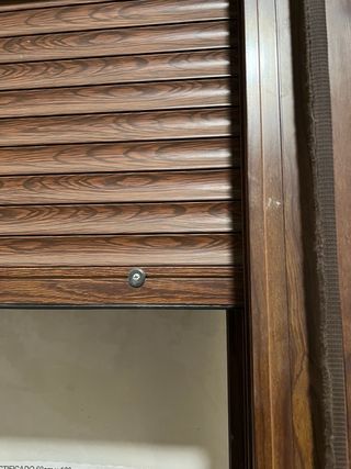 Puerta balconera con persiana